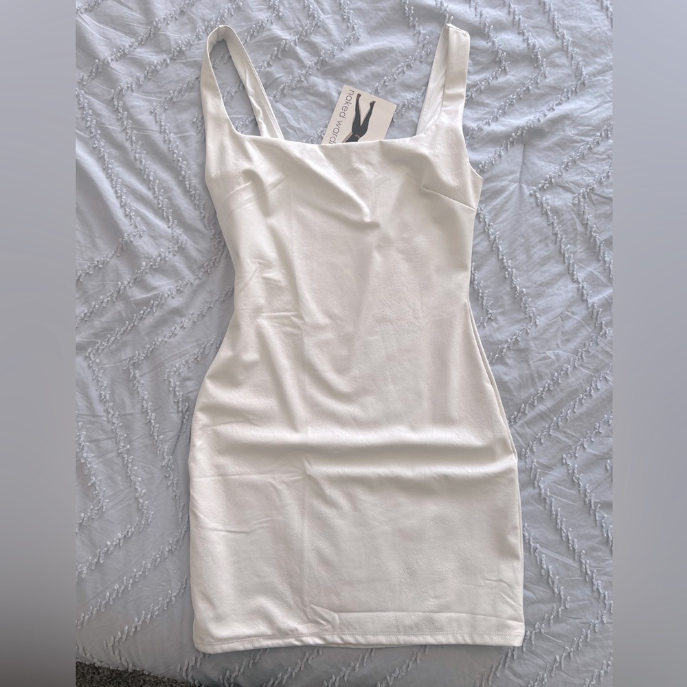 Naked wardrobe white faux leather dress.